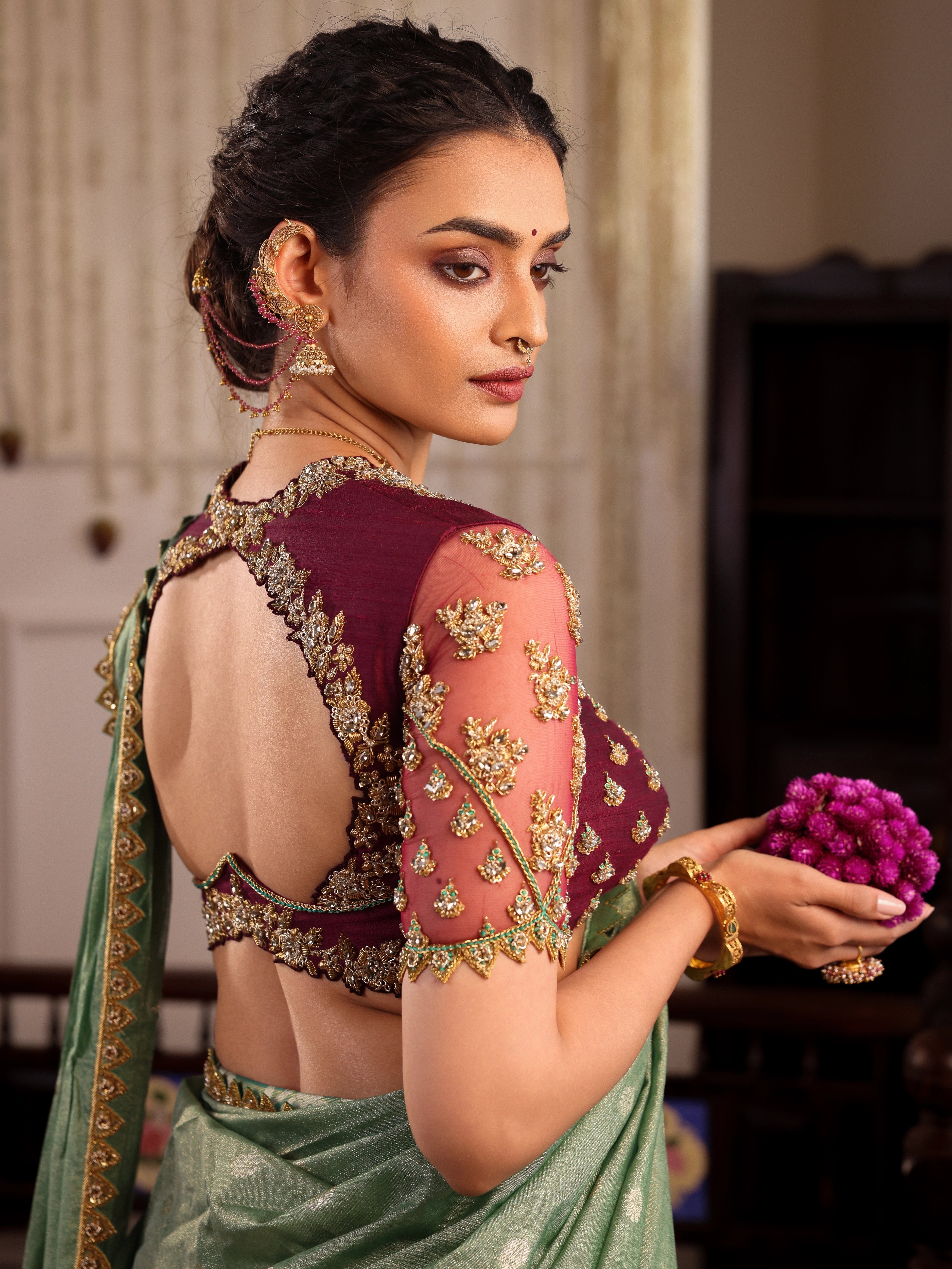 Model Sanskriti Mishra posing in sea green & wine red jacquard silk half saree with vummidi bangaru jewellery