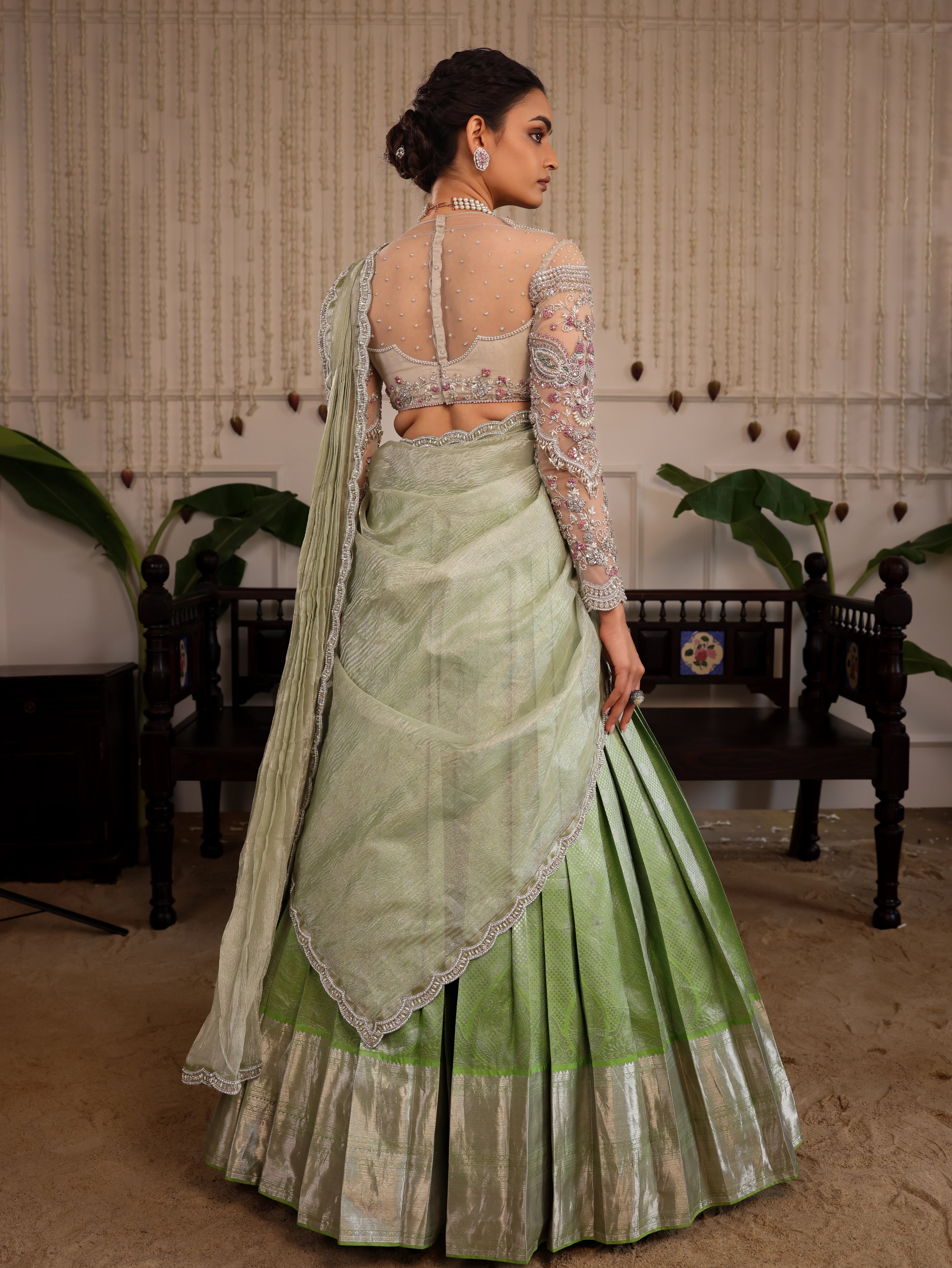 Model Sanskriti Mishra in pastel green kanjeevaram silk half saree with vummidi bangaru diamond jewellery