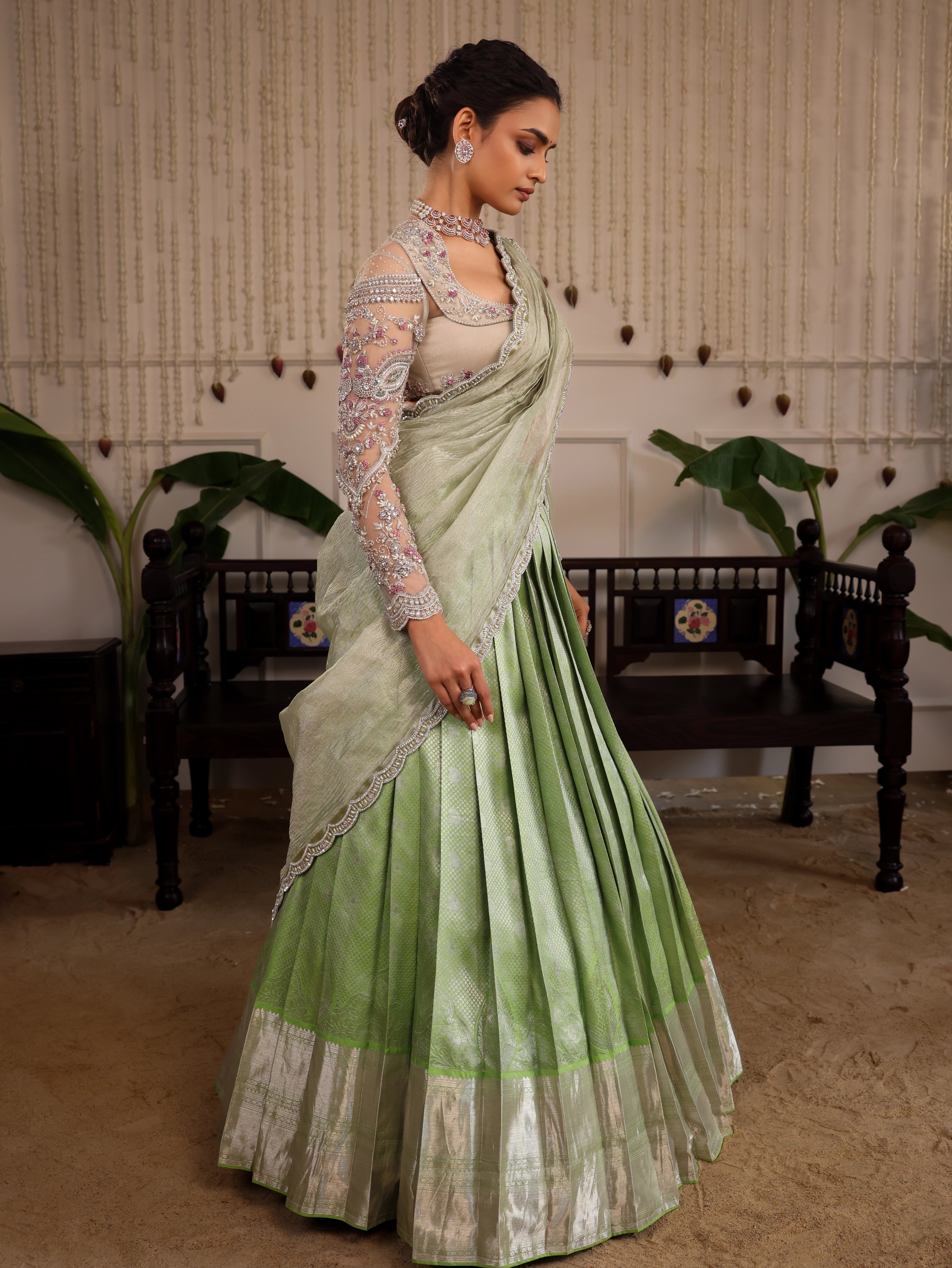 Model Sanskriti Mishra in pastel green kanjeevaram silk half saree and vummidi bangaru diamond jewellery