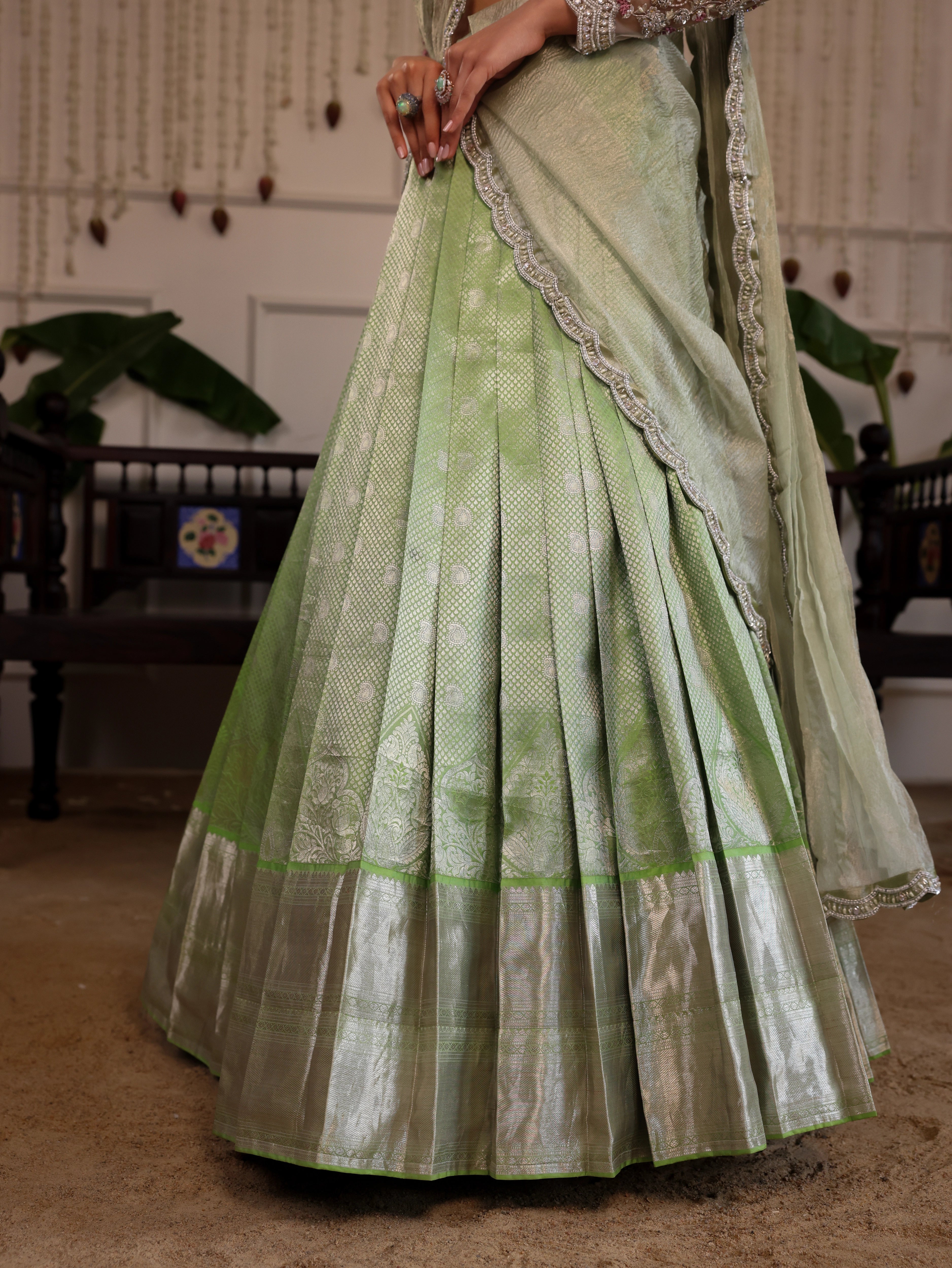 Model Sanskriti Mishra in pastel green kanjeevaram silk saree and vummidi bangaru diamond jewellery