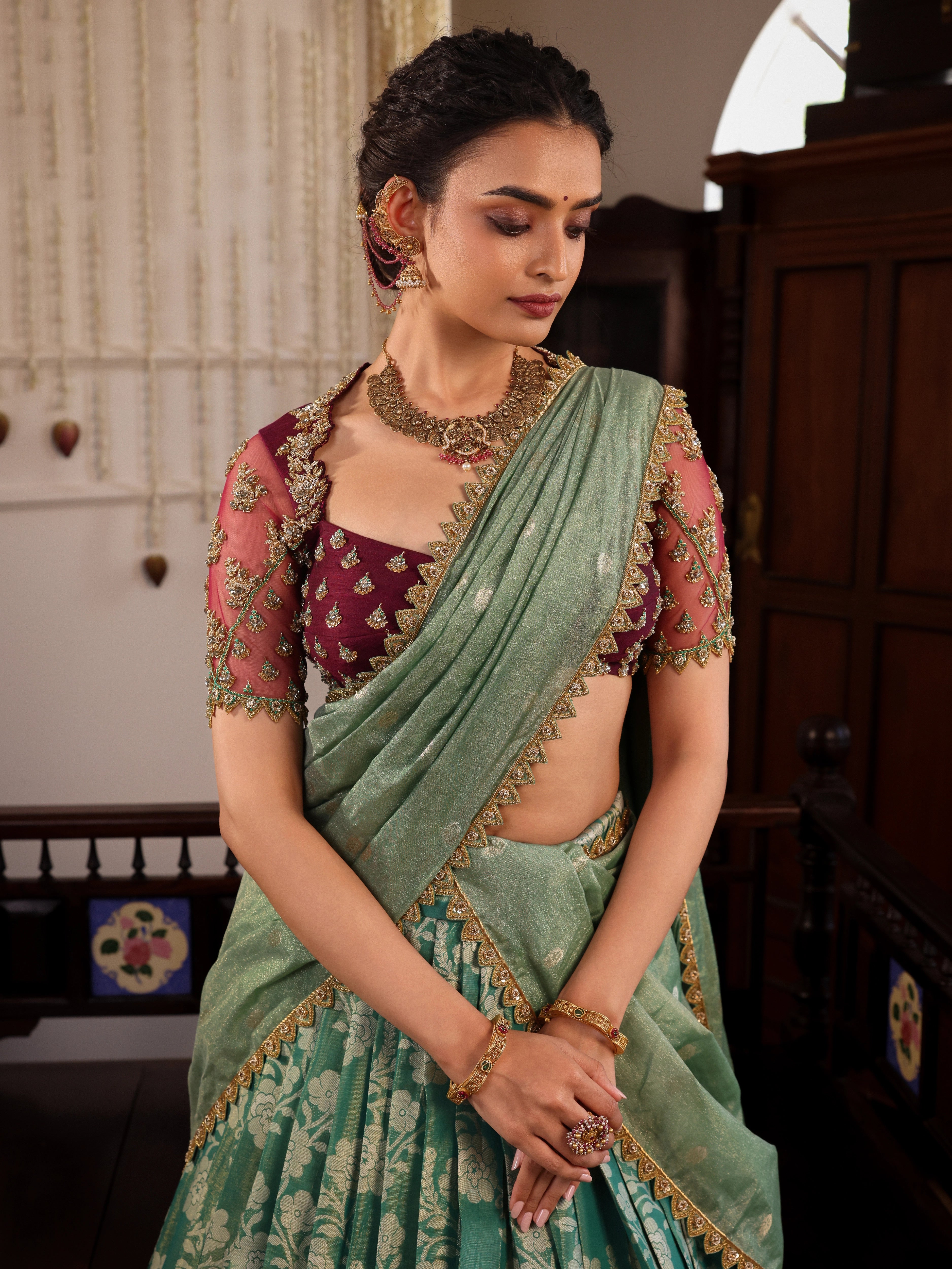 Model Sanskriti Mishra stuns in sea green & wine red jacquard silk half saree with vummidi bangaru jewellery