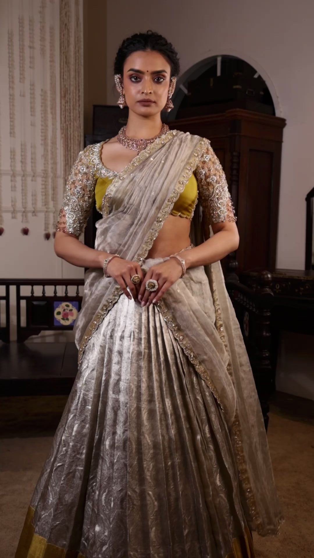 Model Sanskriti Mishra in a gold and silver kanjeevaram silk half saree music video with vummidi bangaru jewllery