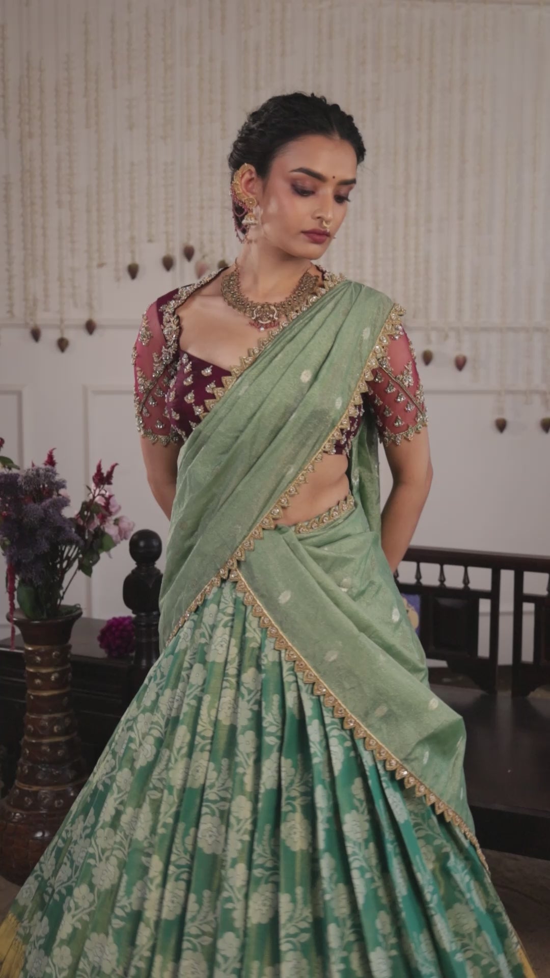 Model Sanskriti Mishra in sea green & wine red jacquard silk half saree music video with vummidi bangaru gold jewellery
