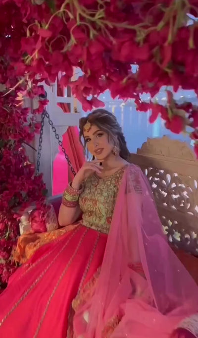 Video of Bride from Baghdad, Iraq posing in a hot pink and mint green raw silk lehenga, handcrafted by team Archana Karthick.