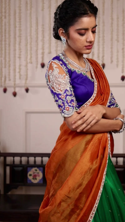 Model Himanshi in orange, blue & green sambalpuri silk half saree music video with vummidi bangaru jewellery
