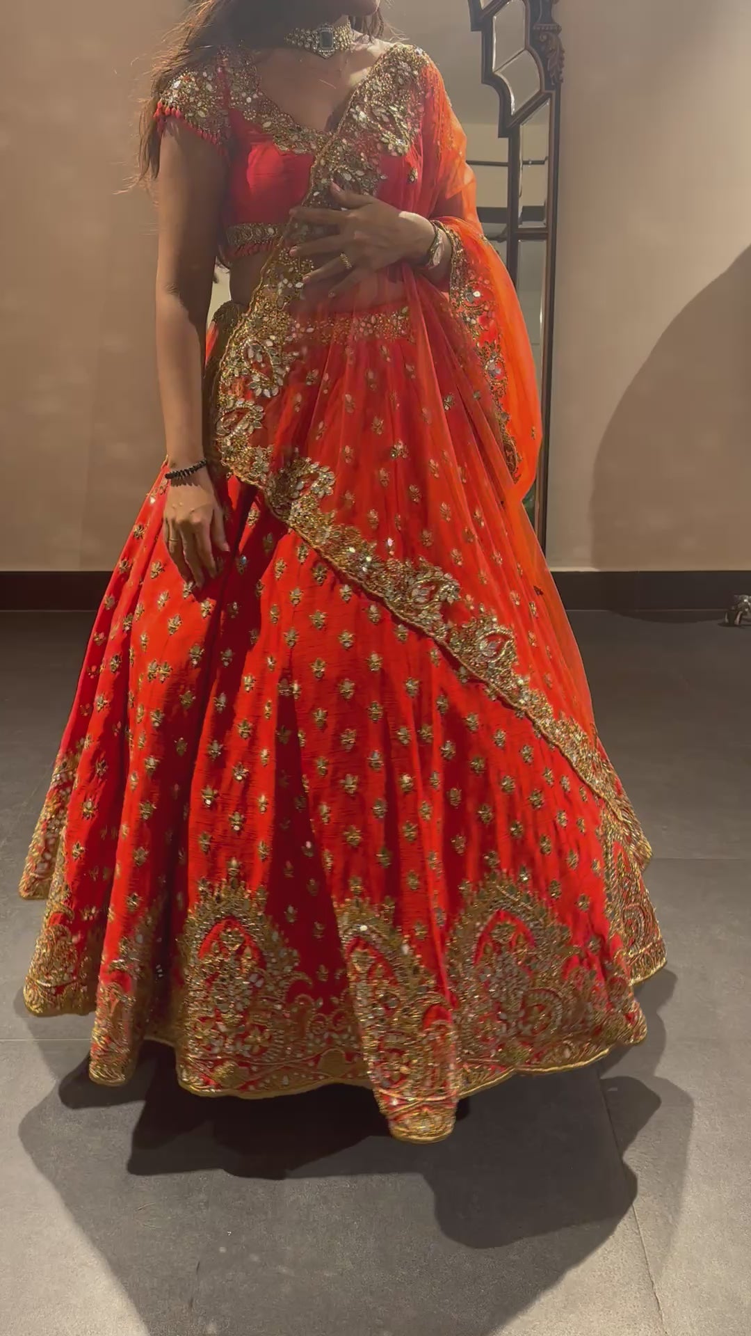 Bride Vaishali from Dubai, during her fittings in orange lehenga designed by Archana Karthick.