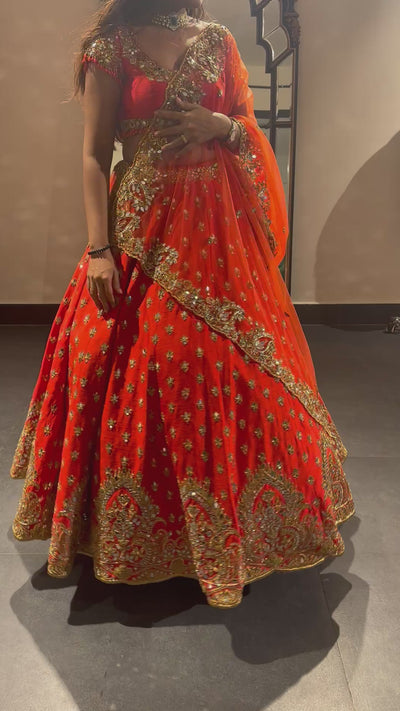 Bride Vaishali from Dubai, during her fittings in orange lehenga designed by Archana Karthick.